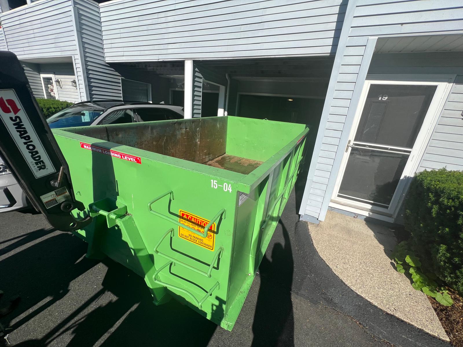 Dumpster delivery at residential complex