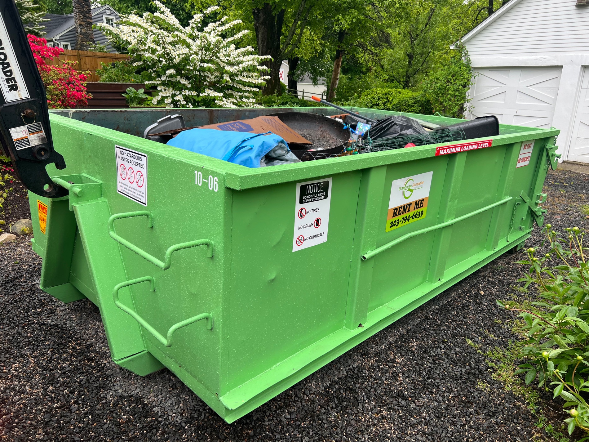 10-yard dumpster in use at residential property